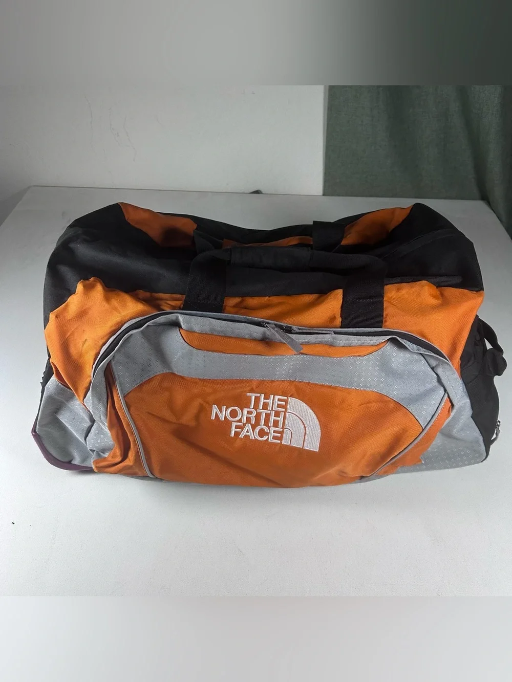 The North Face Rolling Thunder 26” Wheeled Carry On Duffle Bag Orange Silver